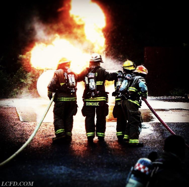 2nd Assistant Chief Donohue guiding his team during a propane fire simulation